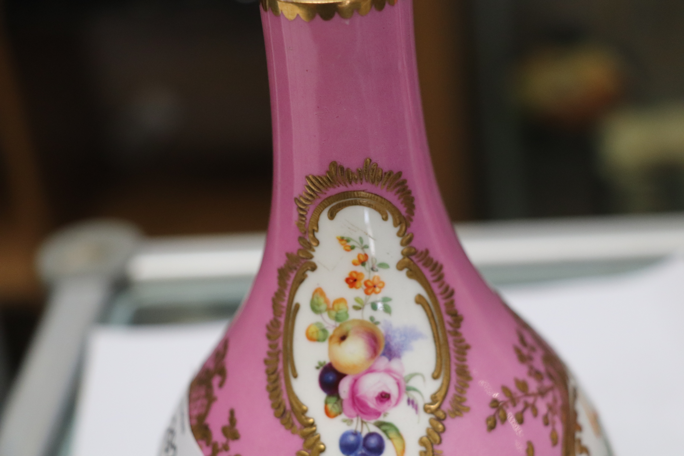 A pair of 19th century Sevres bottle vases and stoppers decorated with sprays of flowers within gilt - Image 5 of 6