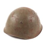 A WWII Italian army M33 steel combat helmet, with leather liner and chin strap.