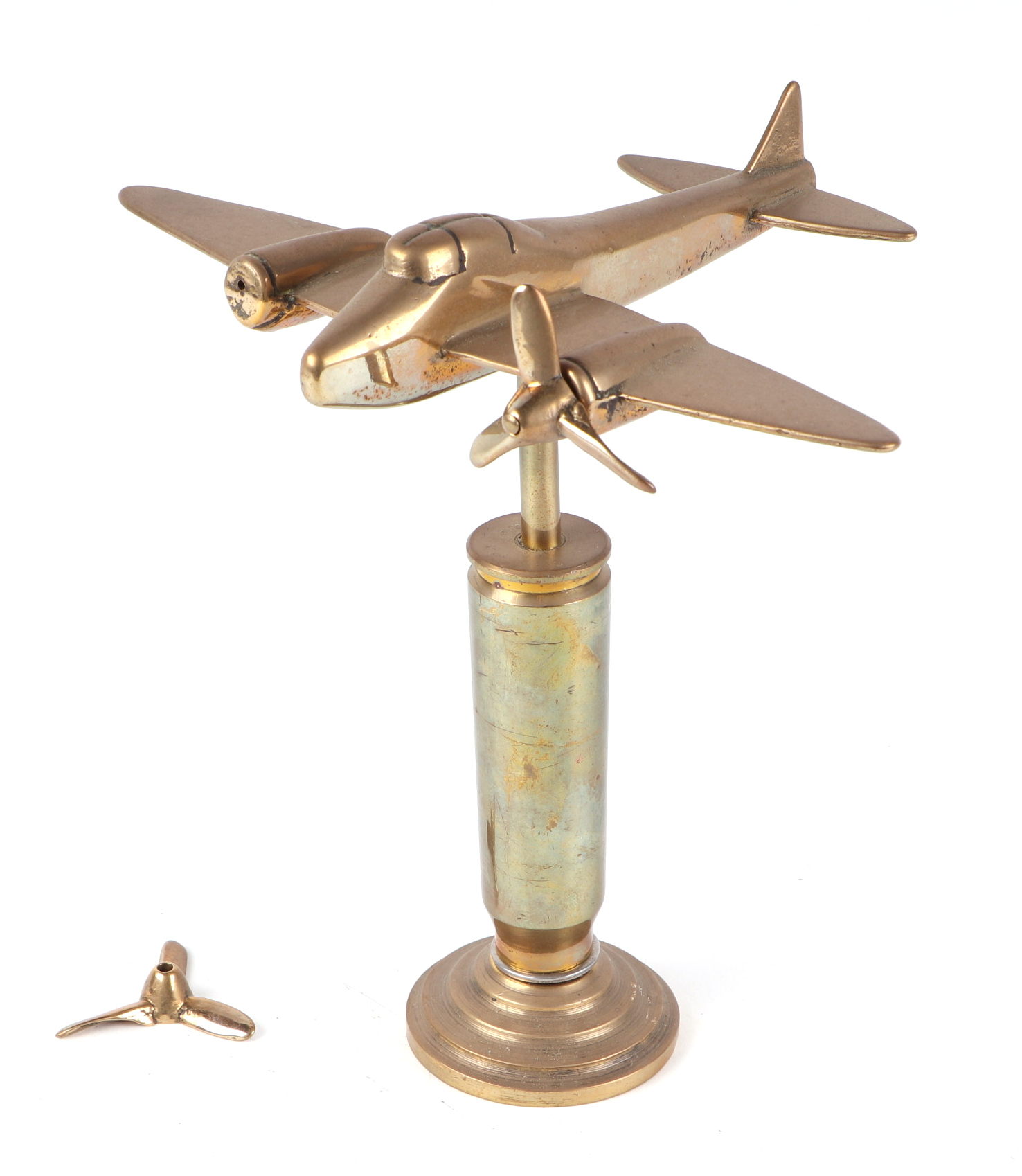 A trench art cast brass model of Mosquito aircraft, mounted on a brass plinth, wingspan 20cm.