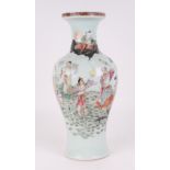 A Chinese famille rose baluster vase, decorated figures and deities, with red seal mark to the