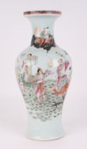 A Chinese famille rose baluster vase, decorated figures and deities, with red seal mark to the