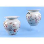 A pair of Chinese famille rose squat vases, decorated with figures and a landscape, mark to the