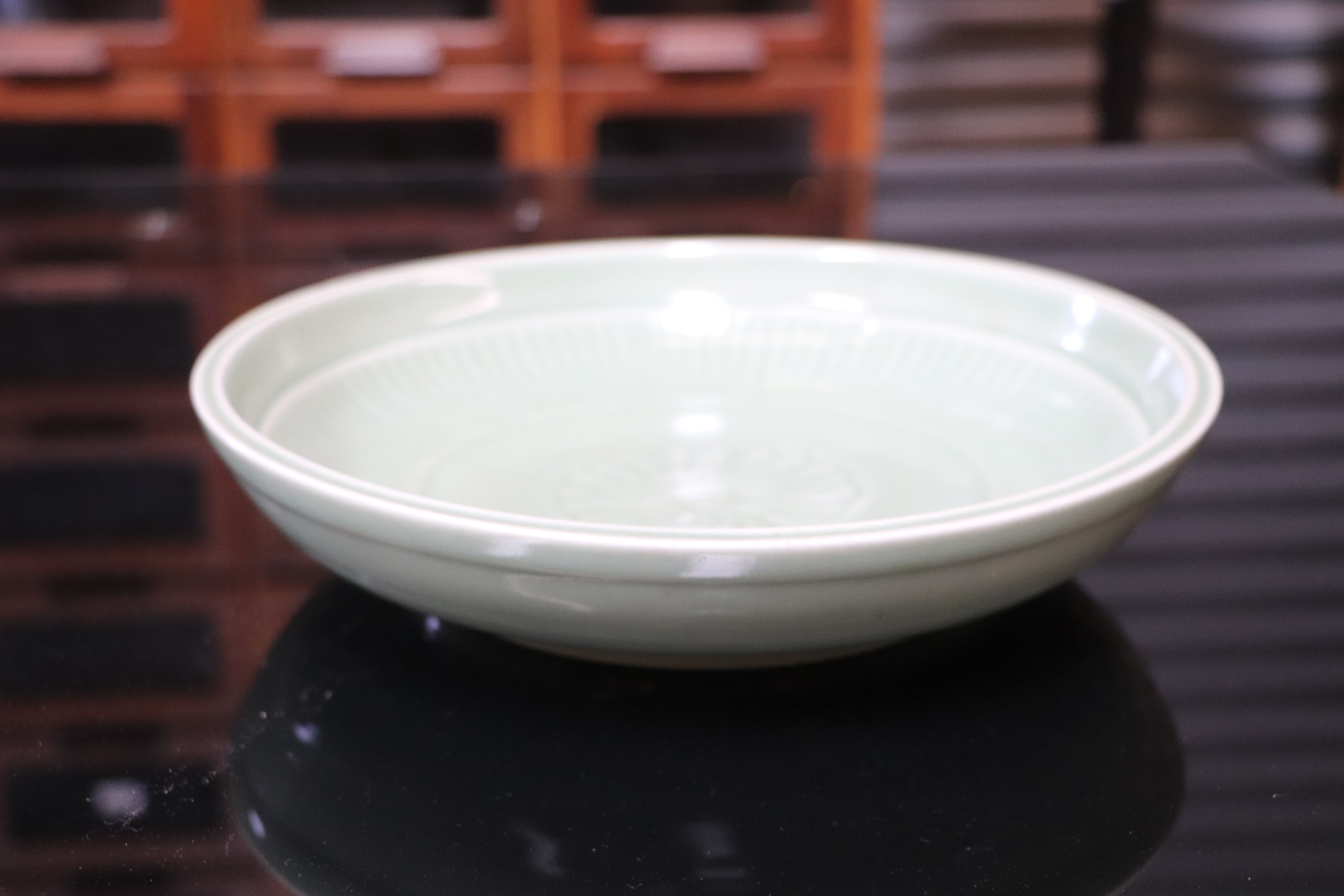 A Chinese celadon glaze shallow dish, with six character blue marks to the underside, 26cm diameter, - Image 10 of 10