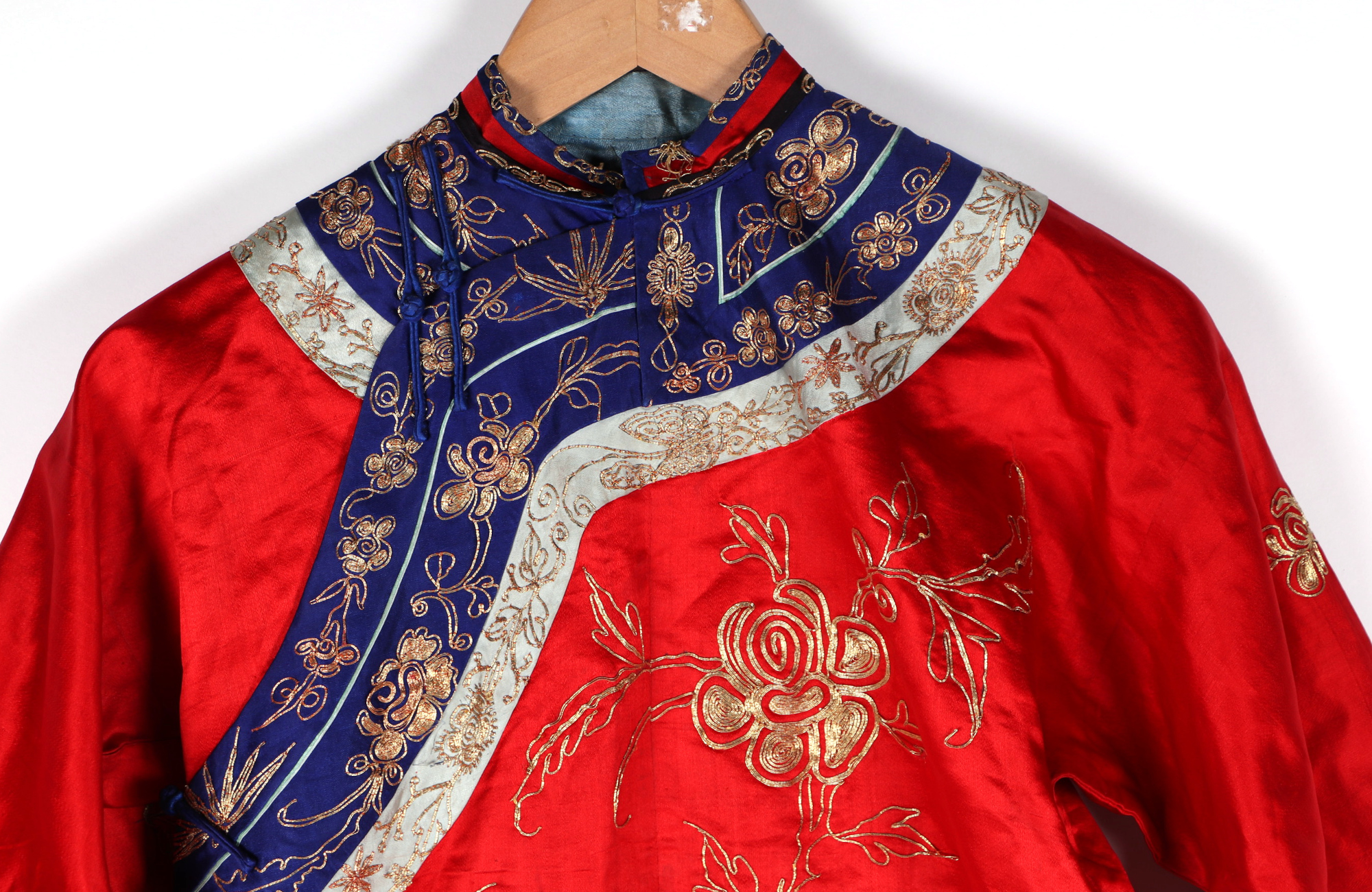 A Chinese silk short jacket decorated with embroidered bullion wire phoenix and flowers, on a red - Image 2 of 5