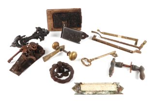 A collection of Georgian and Victorian door furniture, including coffer lock and key, door