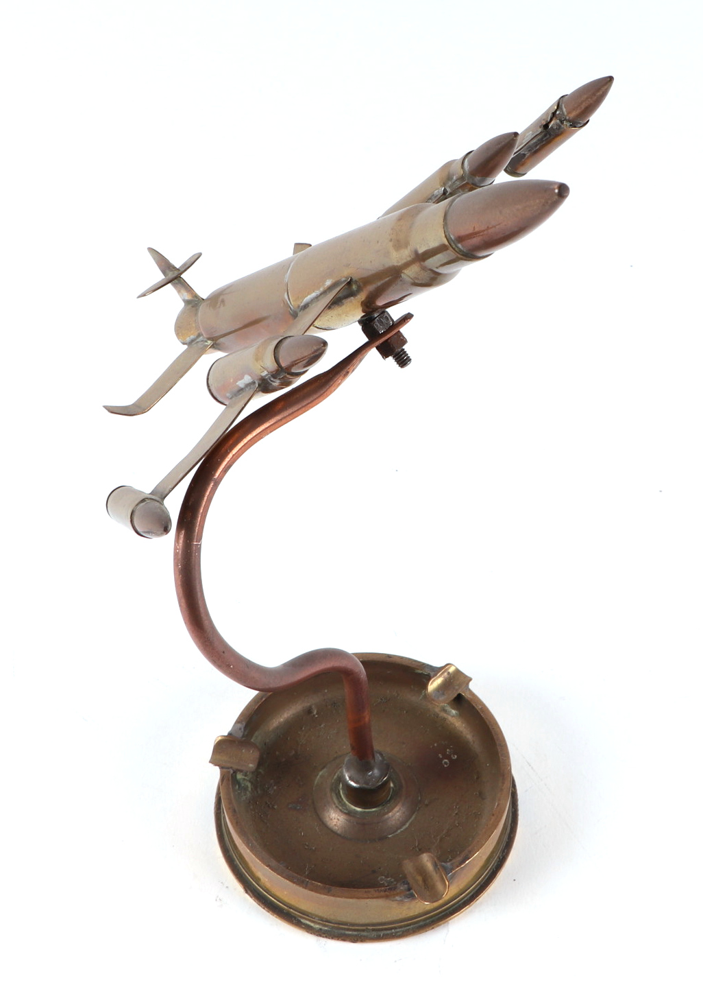 A trench art jet plane, constructed from brass artillery rounds and bullets, mounted on a 1944 dated - Image 2 of 2