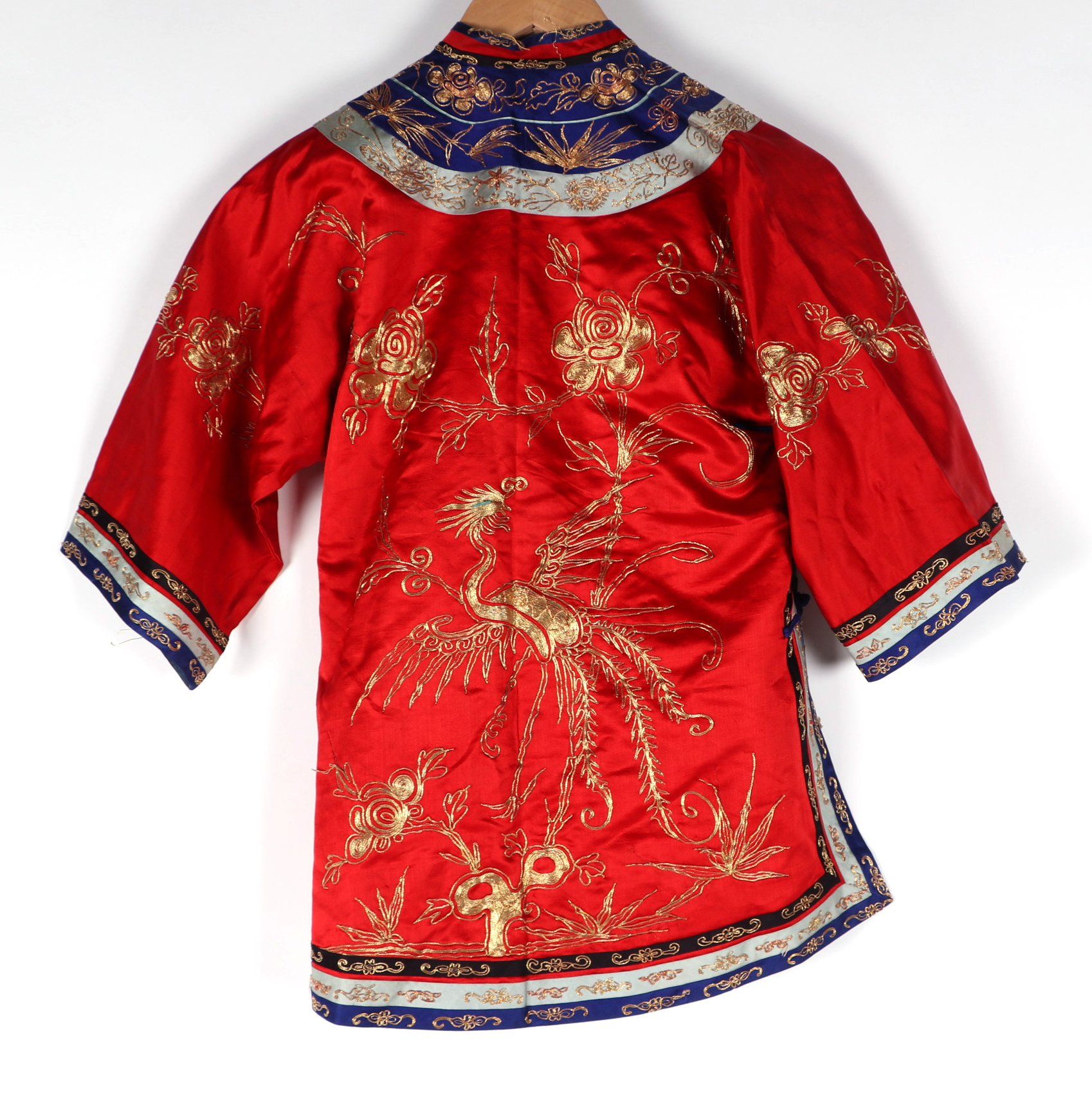 A Chinese silk short jacket decorated with embroidered bullion wire phoenix and flowers, on a red - Image 4 of 5