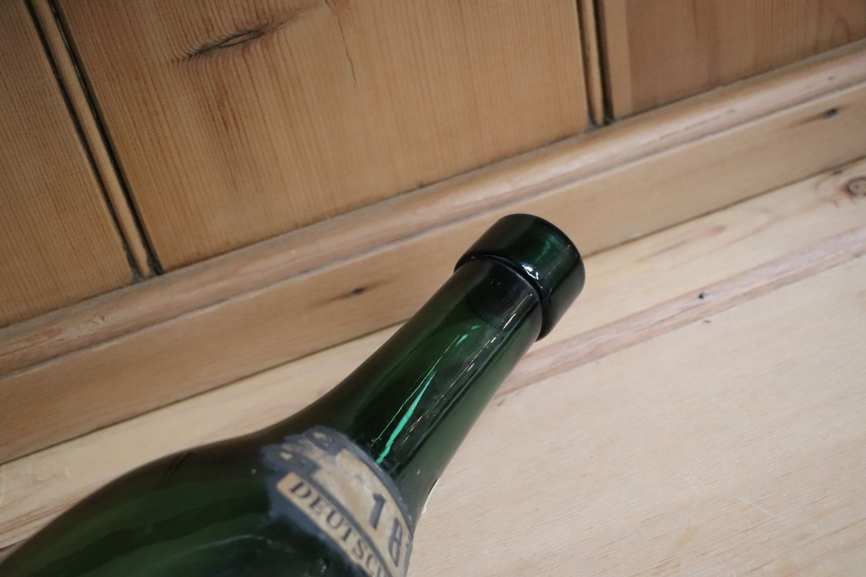 A large hand blown green glass German wine bottle, 51cm high. Condition Report There is a hole - Image 3 of 4