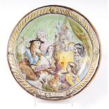 A French pottery charger, decorated a tavern scene, with motto Par St George Je Te Fais Cherlaies,