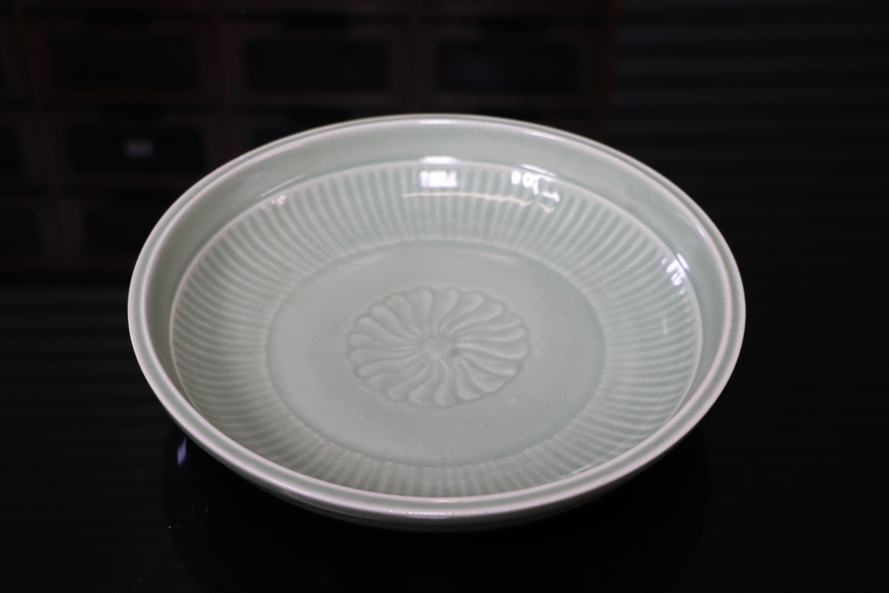 A Chinese celadon glaze shallow dish, with six character blue marks to the underside, 26cm diameter, - Image 9 of 10