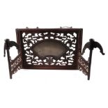 A 19th century Qing period pierced hardwood and bronze mirror backed hat stand, on a pierced three