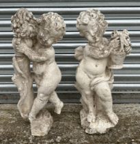 A pair of 19th century composition Coade style stone putti, in well weathered condition, each approx