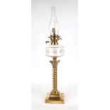 A Victorian brass and glass oil lamp, on on Corinthian column, 58cm high with fittings.