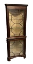 A 19th century mahogany corner display cabinet, having a pair of astragal glazed doors, on bracket