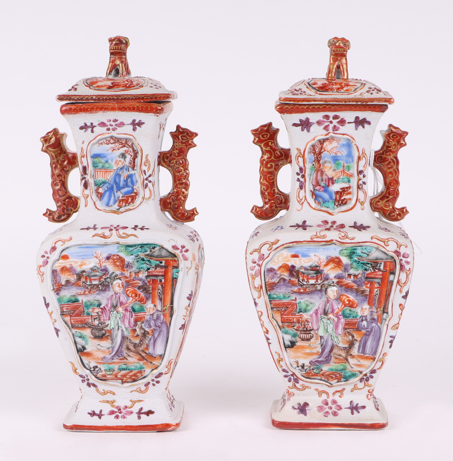 A pair of Chinese Mandarin palette famille rose Export vases and covers moulded in relief with - Image 2 of 25