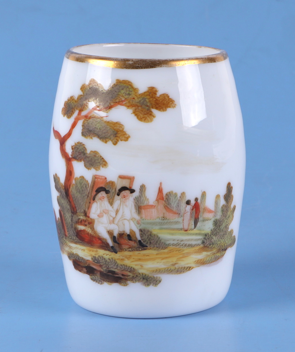 An 18th century German milk glass tankard, decorated a landscape with figures under a tree, 10cm