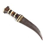 A Middle Eastern dagger, the handle with bone and brass inlaid decoration, the steel blade with an