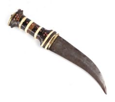 A Middle Eastern dagger, the handle with bone and brass inlaid decoration, the steel blade with an