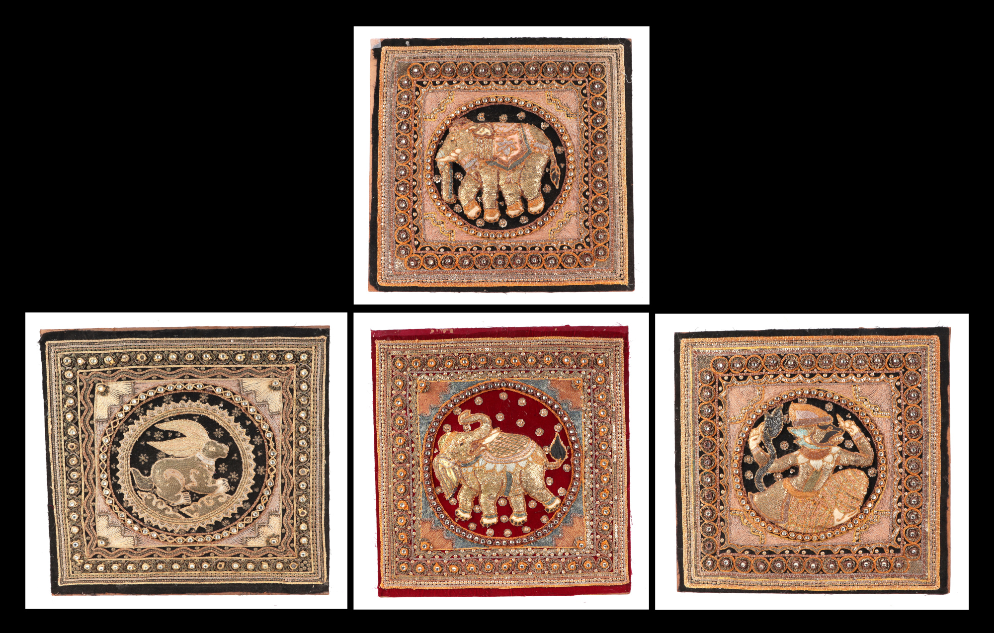 A group of four Indian needlework panels, depicting elephants and mythical creatures, each approx 39