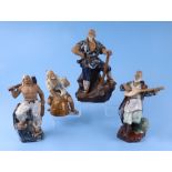 A group of glazed Chinese pottery figures, largest 26cm high (8).