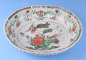 A large Chinese famille vert oval bowl, decorated exotic birds and flowers, 40cm wide. Condition