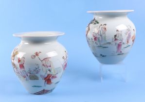 A pair of Chinese famille rose squat vases, decorated with figures and a landscape, mark to the