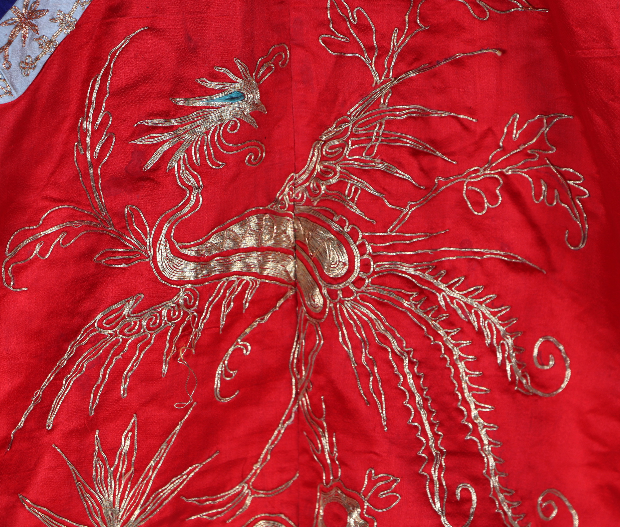 A Chinese silk short jacket decorated with embroidered bullion wire phoenix and flowers, on a red - Image 3 of 5