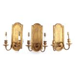 A set of three Victorian giltwood & gesso twin-arm sconce wall lights in the style of girandoles,