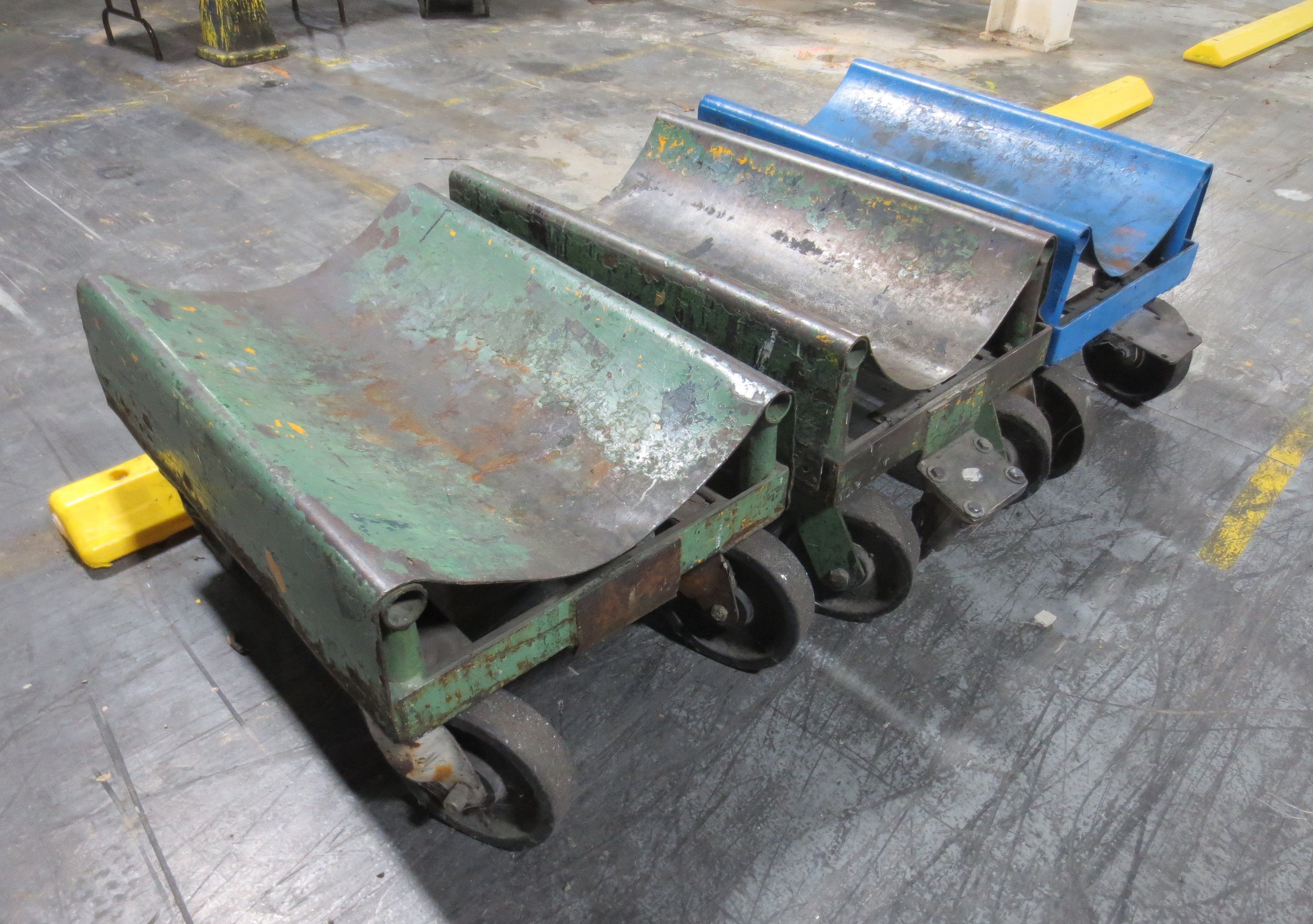 (3) roll handling carts on wheels.