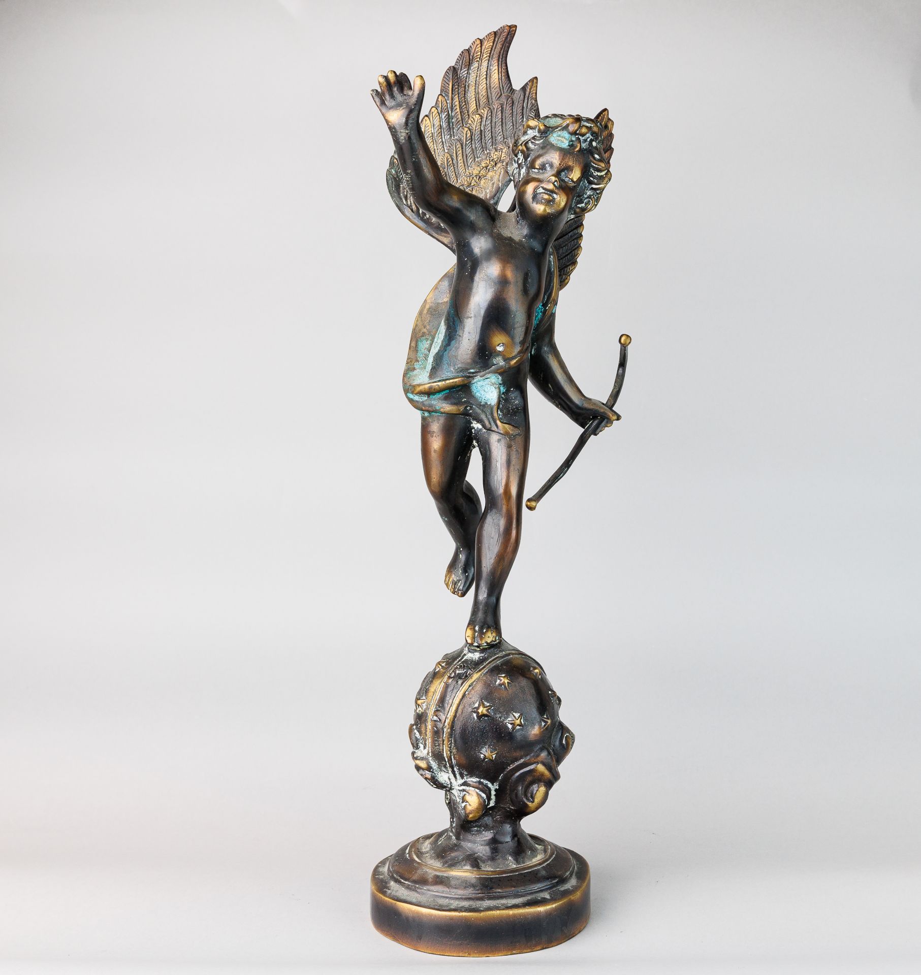 Bronze Sculpture "Cupid with his Bow" standing on an orbit