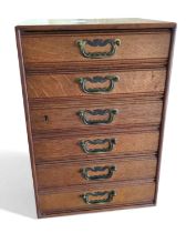 An early 20th century oak table top filing cabinet