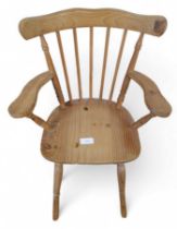 A small pine rocking chair, 94cm high, 70cm deep
