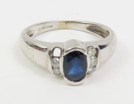 A 9ct white gold sapphire and diamond ring, the ov
