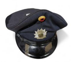 A post WWII German police visor hat, by Alkero, in