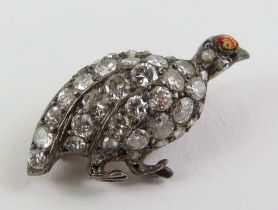 An early 20th century brooch in the form of a qua