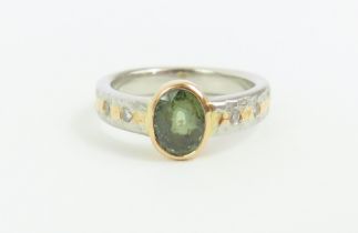 A contemporary 18ct yellow gold and platinum, gree