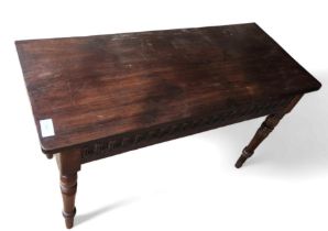 A stained oak side table, with carved panel to the