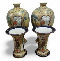 A pair of Japanese baluster vases, decorated in co