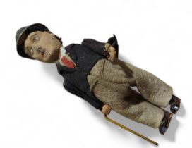 An early 20th century tinplate clockwork toy of Ch