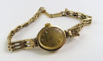 A ladies 9ct gold Acccurist wristwatch on gate lin