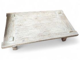 A limed oak coffee table, on four block legs, 48cm