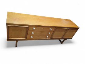 A low mid-20th century sideboard, the three short