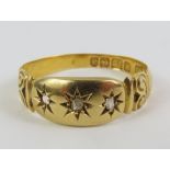 An 18ct gold gypsy type ring, set with two diamond