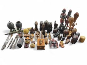 A collection of wooden items, mostly African, to i