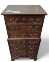 A mahogany chest on chest, of small stature, with