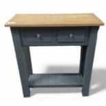 A slate blue painted console table, with light oak