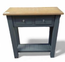 A slate blue painted console table, with light oak