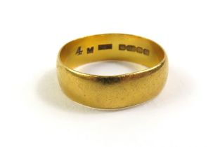 A 22ct gold wedding band, finger size M 1/2 centre
