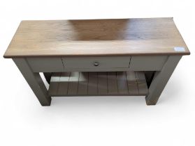 A taupe painted and light oak console table, with