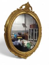 A French style oval gilt framed mirror, 71cm x 53c